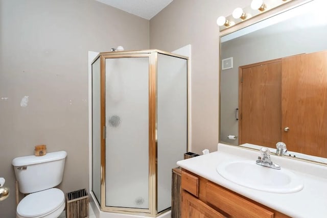 2433 Patricia Dr Unit 24, Urbandale, IA 50322 - full bath featuring vanity, a stall shower, and toilet