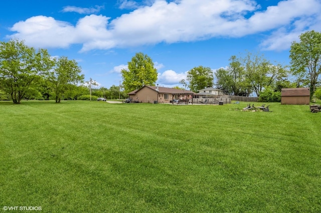 4685 E Broadway Ave, Des Moines, IA 50317 - view of green lawn featuring an outbuilding