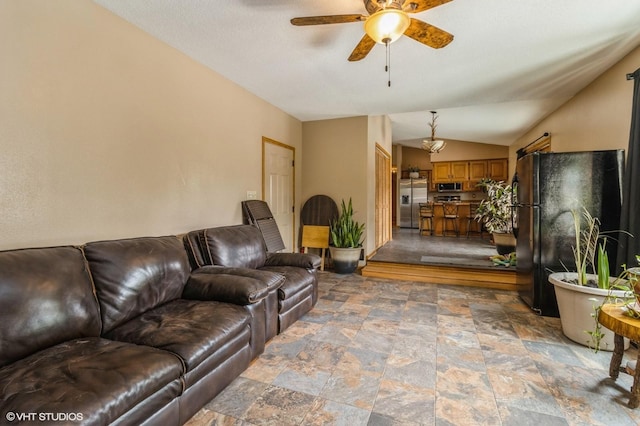 4685 E Broadway Ave, Des Moines, IA 50317 - living room with stone finish flooring, ceiling fan, and lofted ceiling