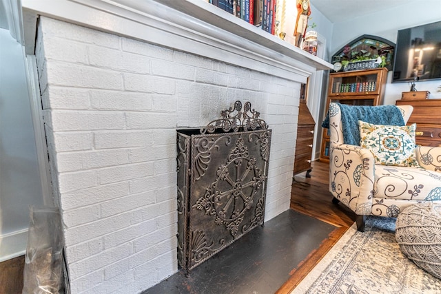 620 W Filmore St, Winterset, IA 50273 - living area with wood finished floors and a fireplace