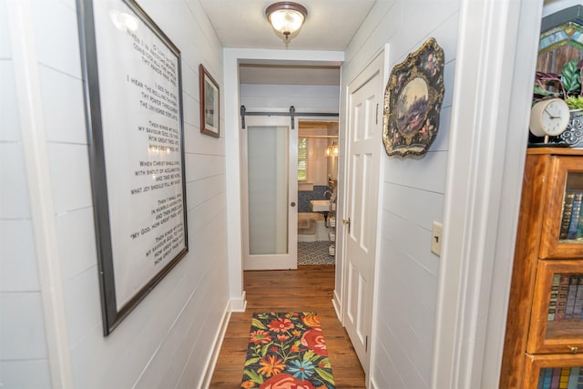 620 W Filmore St, Winterset, IA 50273 - corridor with a barn door and wood finished floors