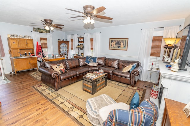 620 W Filmore St, Winterset, IA 50273 - living area featuring light wood finished floors and ceiling fan