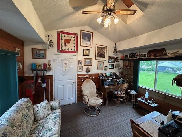 1102 S Broadway St, Toledo, IA 52342 - office area with a textured ceiling, lofted ceiling, wainscoting, a ceiling fan, and wood walls
