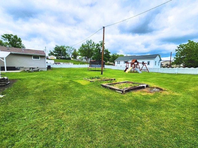 1420 Court Ave, Chariton, IA 50049 - view of yard with a playground and a trampoline