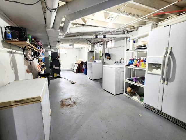 1420 Court Ave, Chariton, IA 50049 - unfinished below grade area featuring white fridge with ice dispenser, washing machine and clothes dryer, refrigerator, water heater, and heating unit