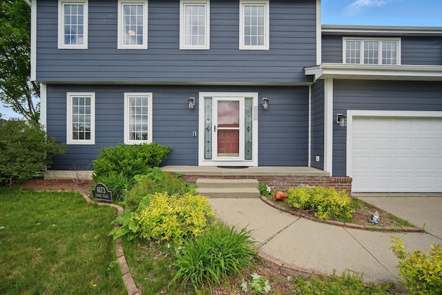 6173 Pommel Pl, West Des Moines, IA 50266 - view of front of property featuring a garage and driveway