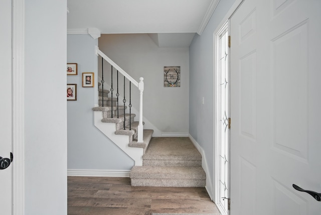 6173 Pommel Pl, West Des Moines, IA 50266 - foyer featuring baseboards, stairway, wood finished floors, and crown molding