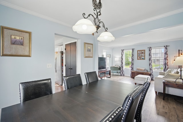 6173 Pommel Pl, West Des Moines, IA 50266 - dining area with wood finished floors and ornamental molding