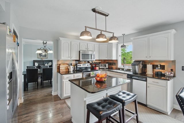 6173 Pommel Pl, West Des Moines, IA 50266 - kitchen featuring stainless steel appliances, a sink, white cabinetry, and light wood-type flooring