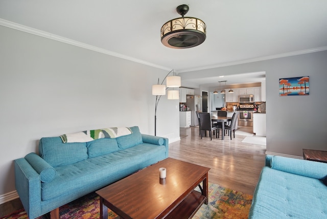 6173 Pommel Pl, West Des Moines, IA 50266 - living room with baseboards, crown molding, and light wood-style floors
