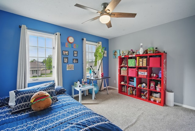 6173 Pommel Pl, West Des Moines, IA 50266 - carpeted bedroom featuring a ceiling fan and baseboards