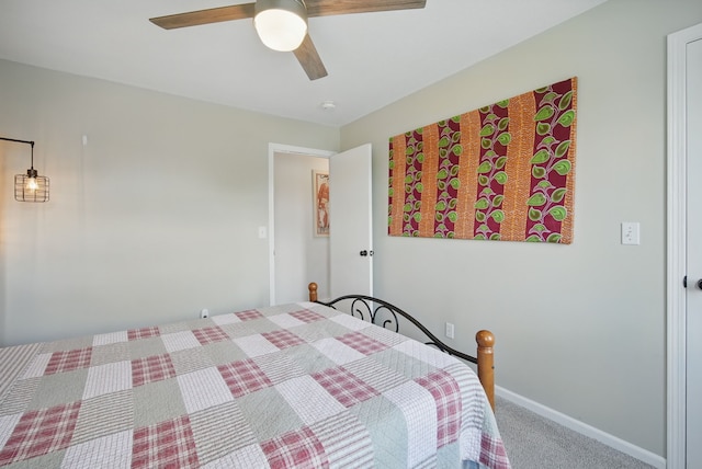 6173 Pommel Pl, West Des Moines, IA 50266 - carpeted bedroom with a ceiling fan and baseboards
