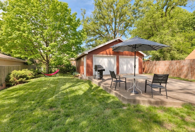 2118 34th St, Des Moines, IA 50310 - view of yard with an outbuilding, a detached garage, and a patio