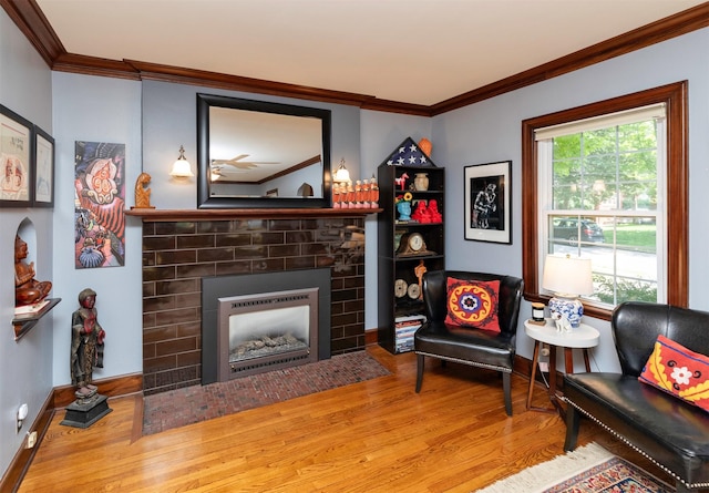 2118 34th St, Des Moines, IA 50310 - living room featuring wood finished floors, a fireplace with flush hearth, ornamental molding, and baseboards