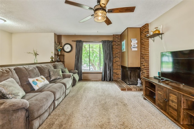 1903 W 5th Ave, Indianola, IA 50125 - living area featuring a ceiling fan, carpet floors, and a textured ceiling