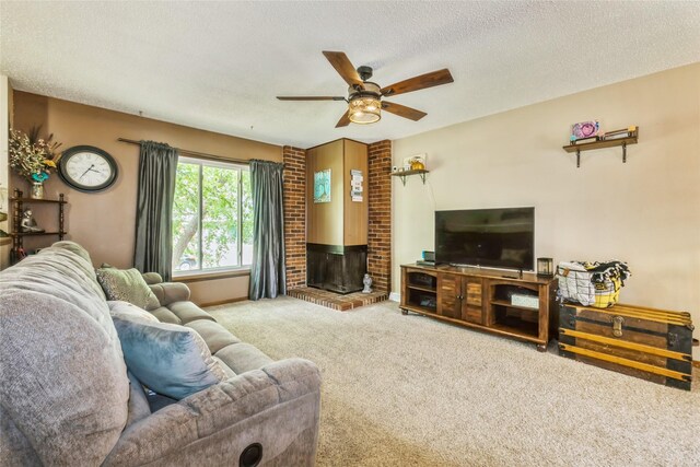 1903 W 5th Ave, Indianola, IA 50125 - living room featuring carpet flooring, a ceiling fan, a textured ceiling, and a fireplace