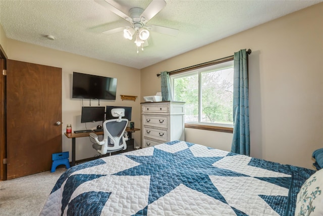 1903 W 5th Ave, Indianola, IA 50125 - bedroom with carpet flooring, a textured ceiling, and a ceiling fan