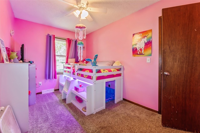 1903 W 5th Ave, Indianola, IA 50125 - bedroom with carpet, baseboards, and a ceiling fan