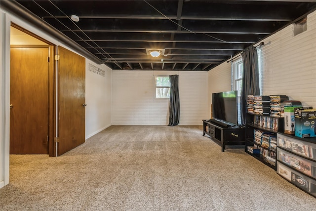 1903 W 5th Ave, Indianola, IA 50125 - basement with brick wall and carpet flooring