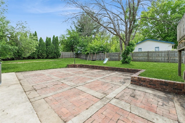 1903 W 5th Ave, Indianola, IA 50125 - view of patio / terrace featuring a playground