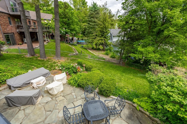 2740 Forest Dr, Des Moines, IA 50312 - view of grassy yard featuring a patio area