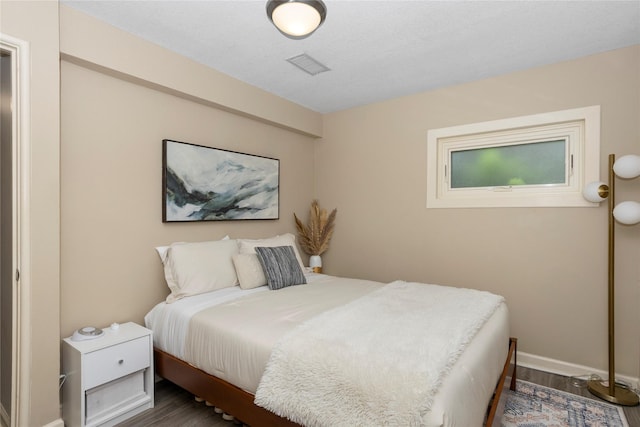 2740 Forest Dr, Des Moines, IA 50312 - bedroom with wood finished floors and baseboards