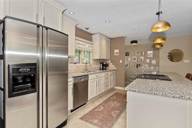 2740 Forest Dr, Des Moines, IA 50312 - kitchen with appliances with stainless steel finishes, a sink, backsplash, light tile patterned floors, and recessed lighting