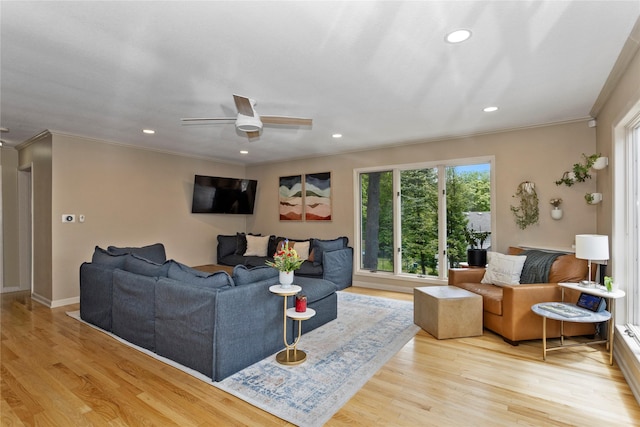 2740 Forest Dr, Des Moines, IA 50312 - living area with crown molding, plenty of natural light, recessed lighting, wood finished floors, and ceiling fan