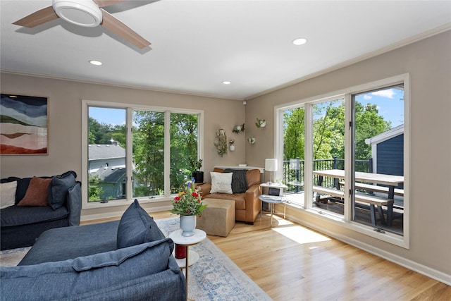 2740 Forest Dr, Des Moines, IA 50312 - living room with ornamental molding, plenty of natural light, light wood finished floors, a ceiling fan, and recessed lighting