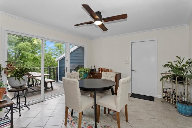 2740 Forest Dr, Des Moines, IA 50312 - dining room with ceiling fan, crown molding, and light tile patterned floors