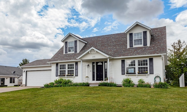 310 NE Meadowlark Ln, Waukee, IA 50263 - cape cod-style house with a front yard, driveway, a garage, and a shingled roof