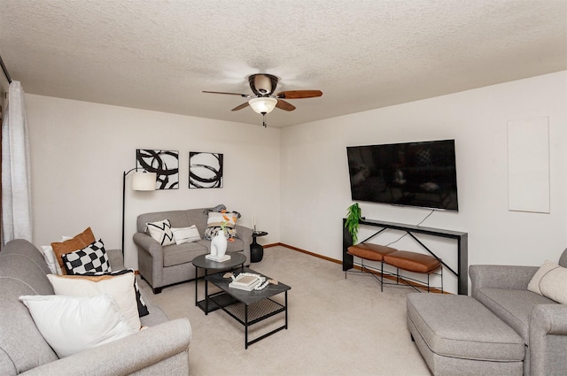 310 NE Meadowlark Ln, Waukee, IA 50263 - living room with light colored carpet, a ceiling fan, and a textured ceiling