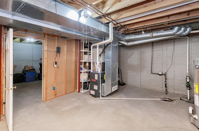 310 NE Meadowlark Ln, Waukee, IA 50263 - unfinished basement with brick wall and heating unit