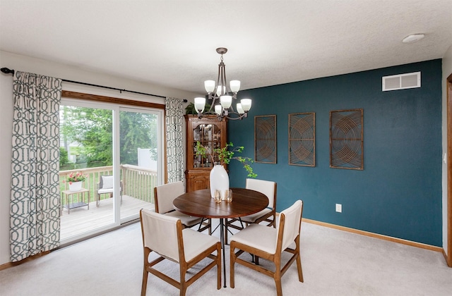 310 NE Meadowlark Ln, Waukee, IA 50263 - dining area with a chandelier and light carpet