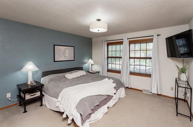 310 NE Meadowlark Ln, Waukee, IA 50263 - bedroom featuring carpet flooring and a textured ceiling