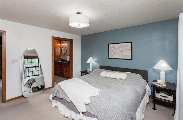 310 NE Meadowlark Ln, Waukee, IA 50263 - carpeted bedroom featuring ensuite bathroom and a textured ceiling