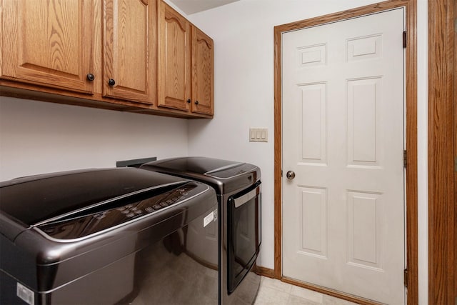 310 NE Meadowlark Ln, Waukee, IA 50263 - laundry area featuring cabinet space and separate washer and dryer