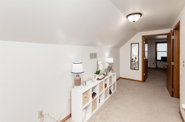 310 NE Meadowlark Ln, Waukee, IA 50263 - corridor with lofted ceiling and carpet flooring