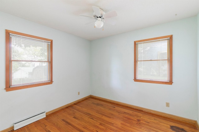 2700 Dosh Rd, Des Moines, IA 50310 - empty room featuring a baseboard radiator, wood finished floors, baseboards, and ceiling fan
