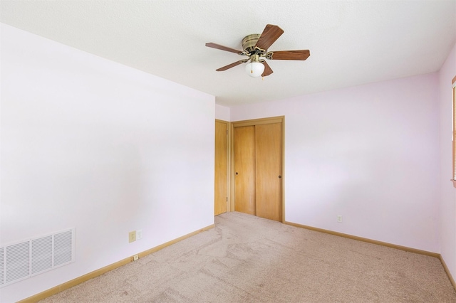 2700 Dosh Rd, Des Moines, IA 50310 - spare room featuring carpet, a ceiling fan, and baseboards