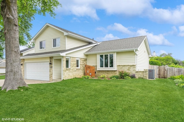 4337 Park Ct, Urbandale, IA 50322 - view of front of house with brick siding, an attached garage, concrete driveway, central air condition unit, and roof with shingles