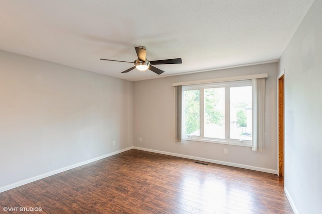 4337 Park Ct, Urbandale, IA 50322 - empty room featuring ceiling fan, dark wood-style flooring, and baseboards