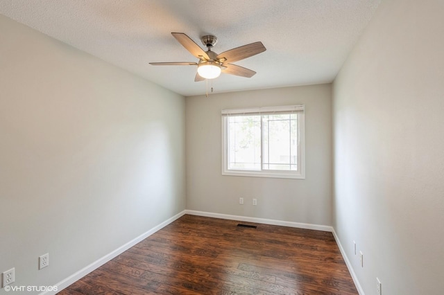 4337 Park Ct, Urbandale, IA 50322 - spare room featuring dark wood finished floors, a ceiling fan, a textured ceiling, and baseboards