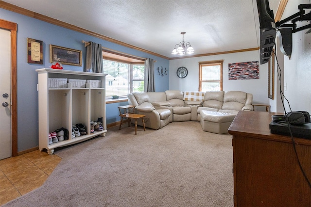 3919 69th St, Urbandale, IA 50322 - living room with ornamental molding, a chandelier, baseboards, and carpet