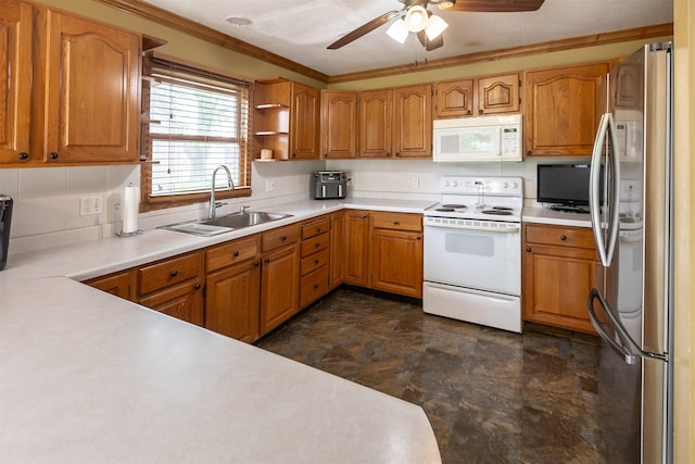 3919 69th St, Urbandale, IA 50322 - kitchen with white appliances, a sink, a ceiling fan, stone finish flooring, and light countertops