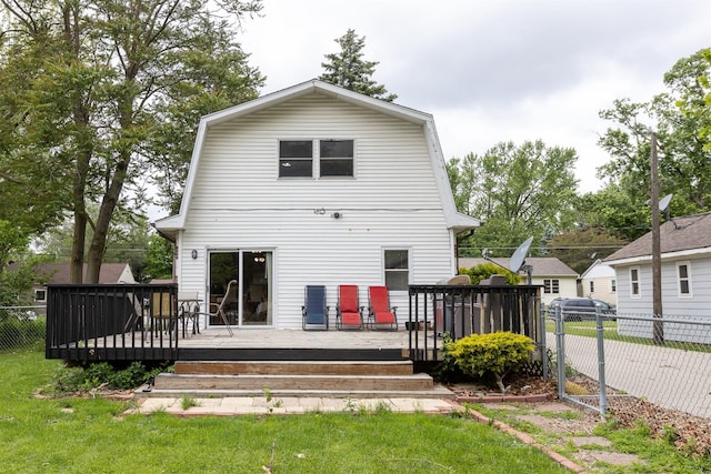 3919 69th St, Urbandale, IA 50322 - back of property featuring a gambrel roof and a wooden deck