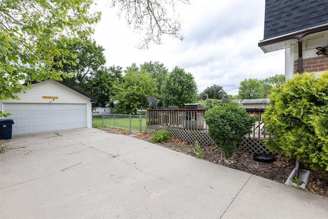 3919 69th St, Urbandale, IA 50322 - view of patio featuring a detached garage and an outdoor structure