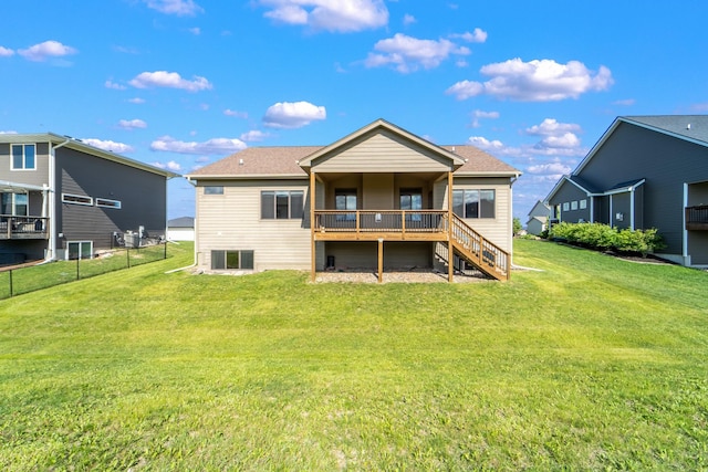 916 NE Silkwood St, Grimes, IA 50111 - rear view of house with stairway and a wooden deck