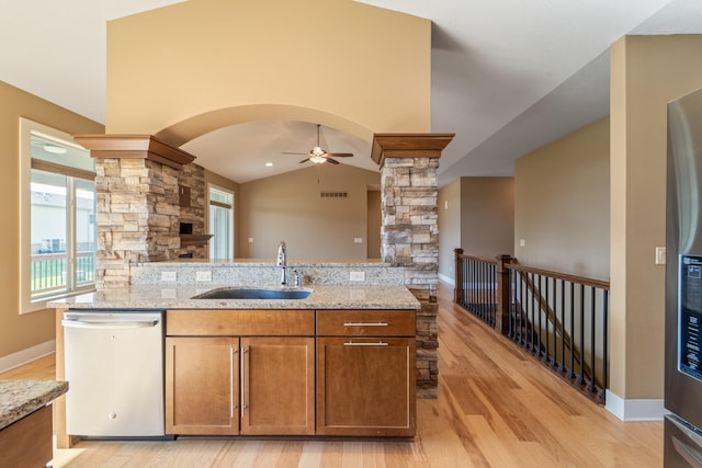 916 NE Silkwood St, Grimes, IA 50111 - kitchen with dishwasher, ornate columns, a ceiling fan, a sink, and open floor plan