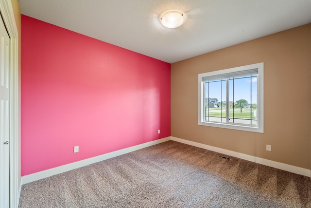 916 NE Silkwood St, Grimes, IA 50111 - spare room featuring carpet flooring and baseboards